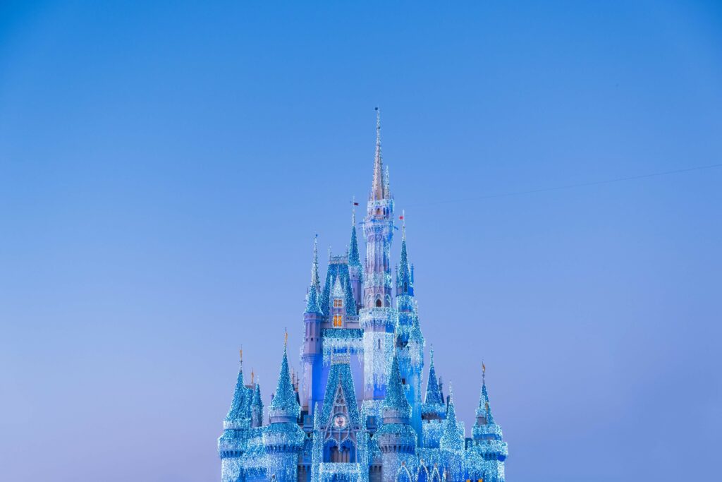 Disney castle on a blue sky background. 